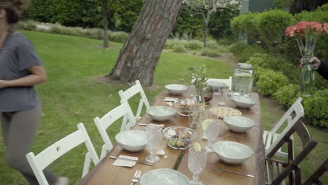 Men-and-women-serving-table-outdoor